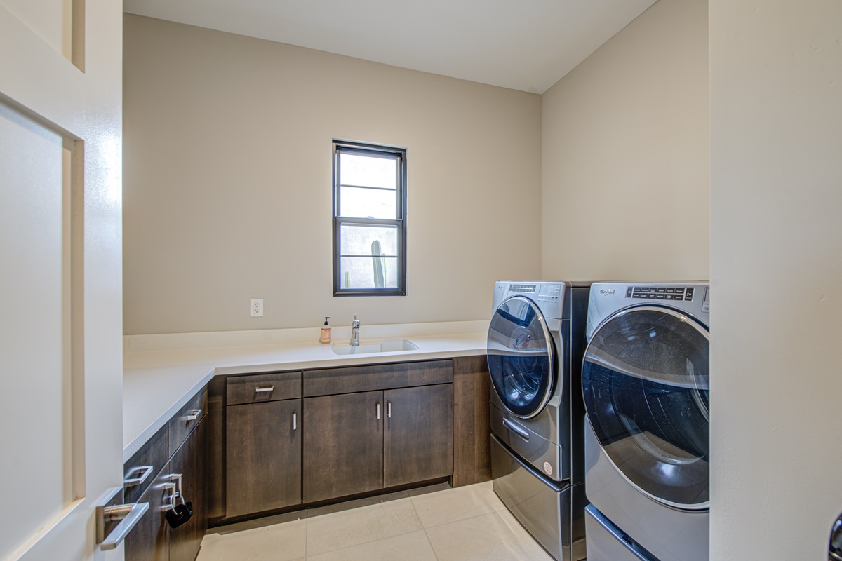 The laundry room with washer and dryer designed for convenience and functionality.