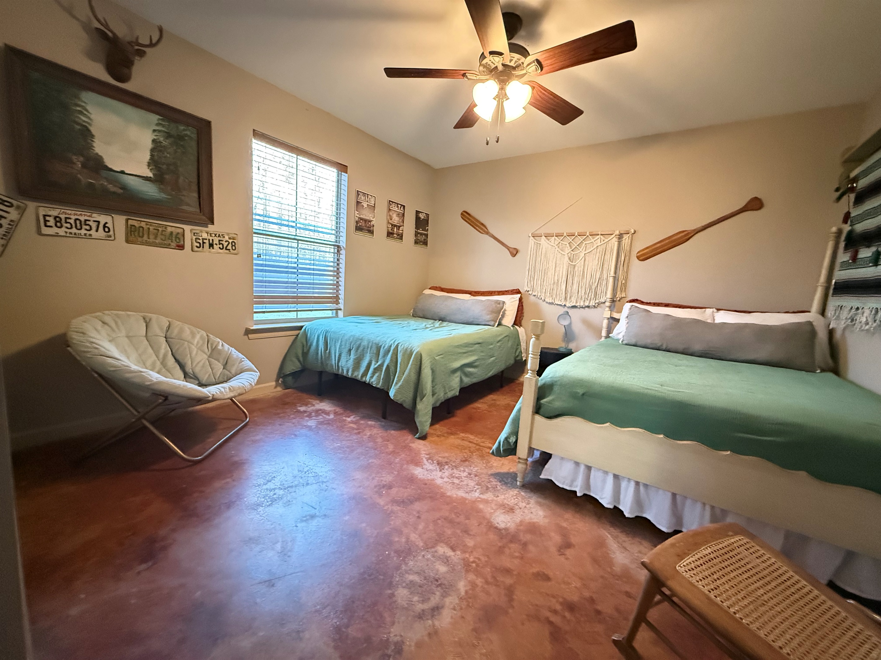 Guest Bedroom features two full size beds and lovely view of woods from bedroom window