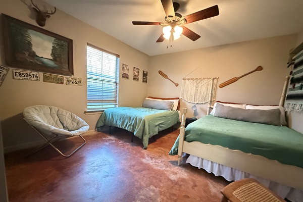 Guest Bedroom features two full size beds and lovely view of woods from bedroom window