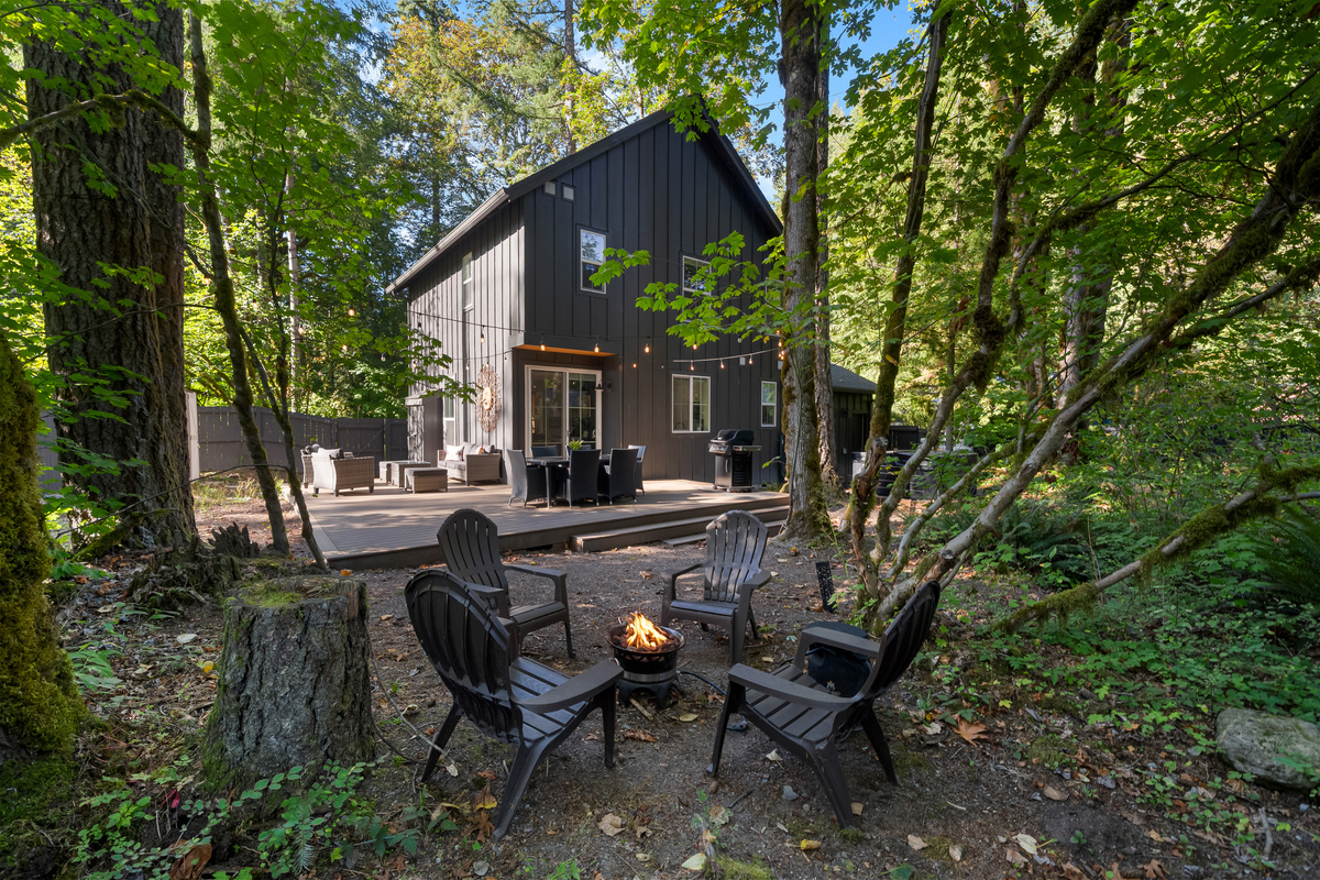 One of two Mt. Hood cabins with cozy outdoor living — dine, lounge, and gather around the fire together.