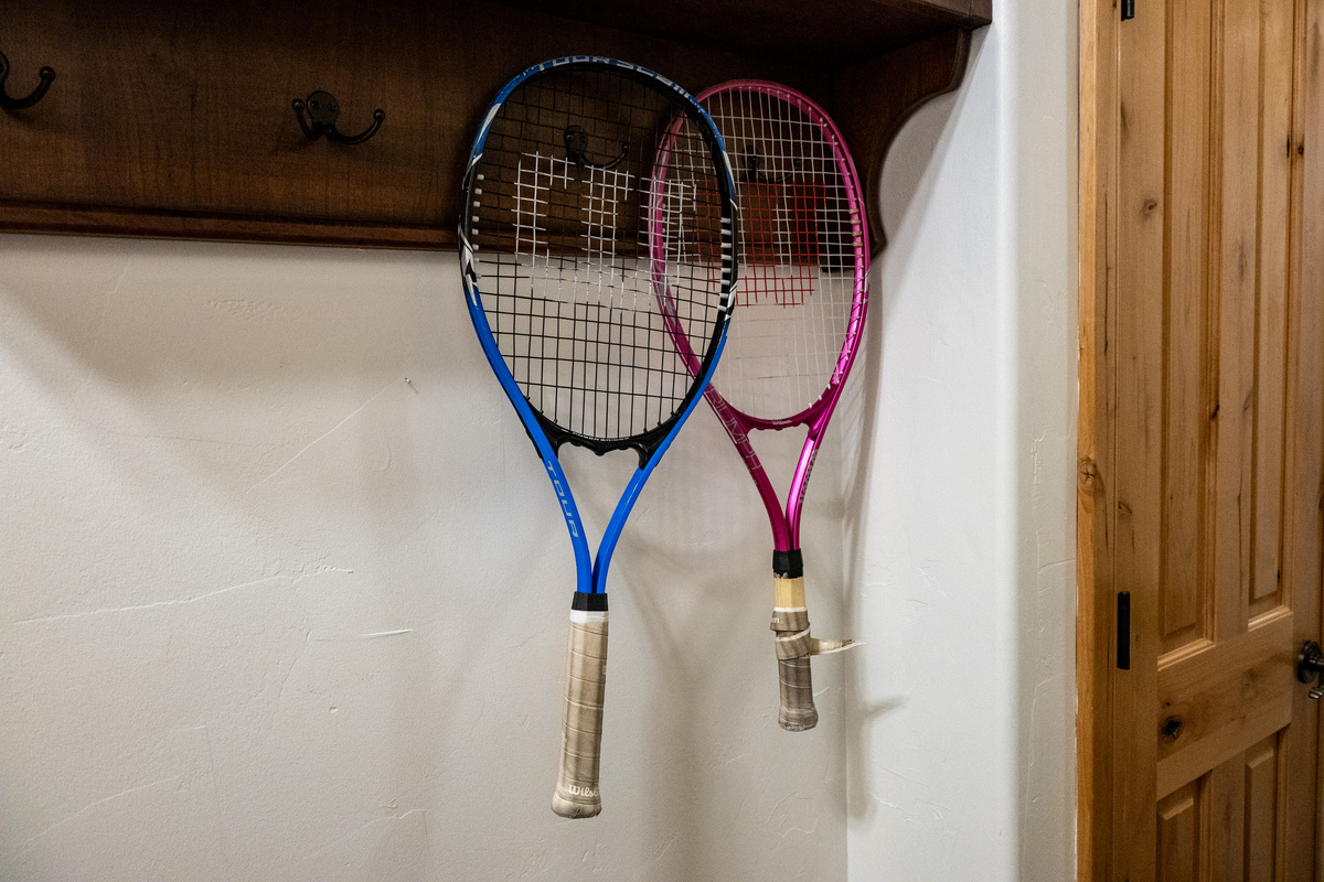 Tennis racquets are ready for guests looking to enjoy the community amenities.
