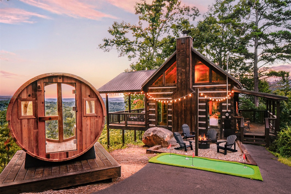 Welcome to The Icon! An *iconic* log cabin with a modern twist! Brand new furnishings and renovation, barrel sauna, putt putt, hot tub, bed swing and MORE!