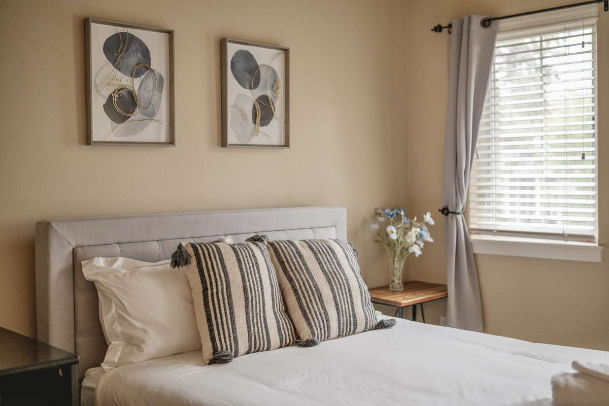 Bedroom with a queen bed and a comfortable medium-feel mattress.
