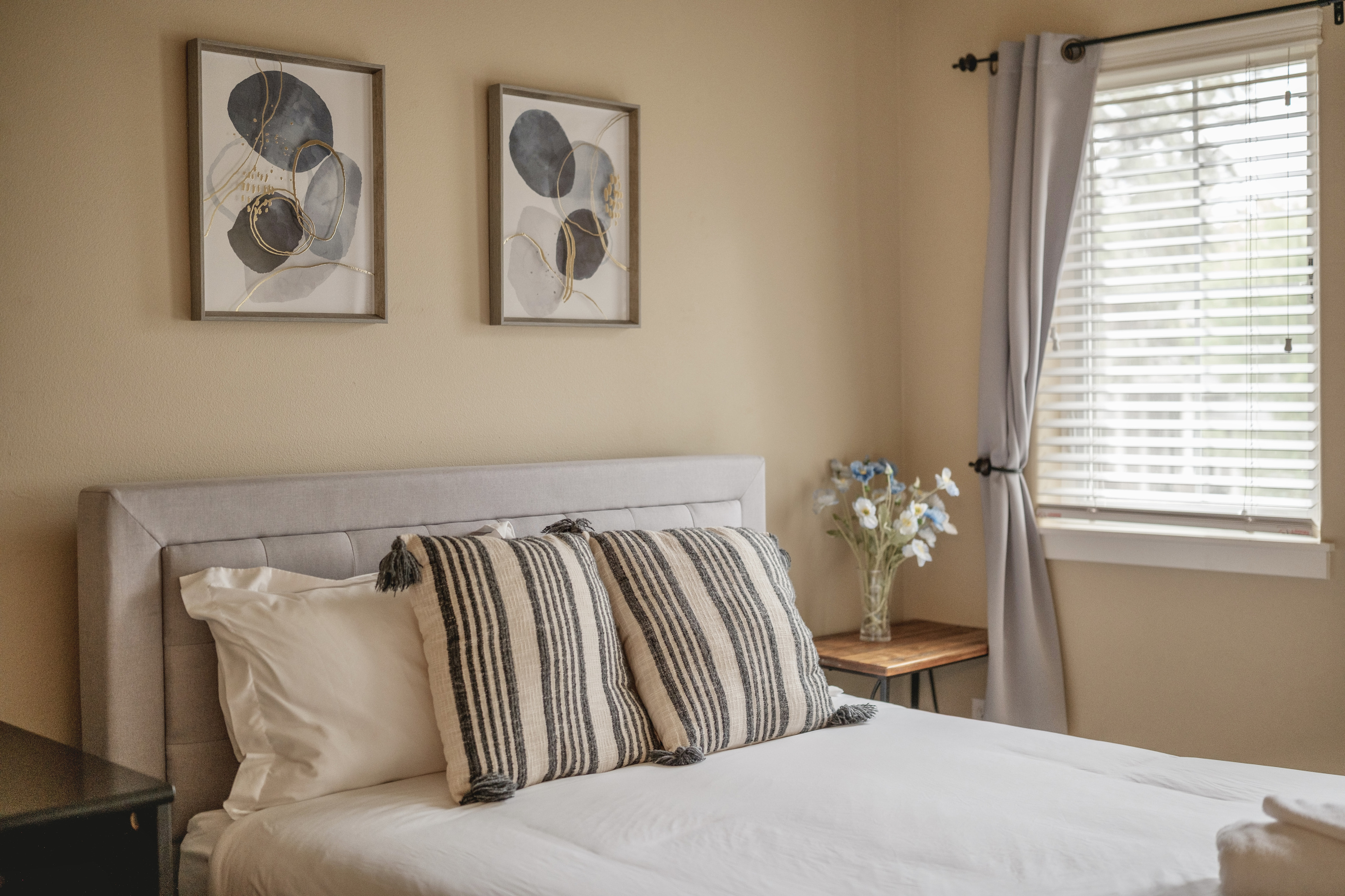 Bedroom with a queen bed and a comfortable medium-feel mattress.