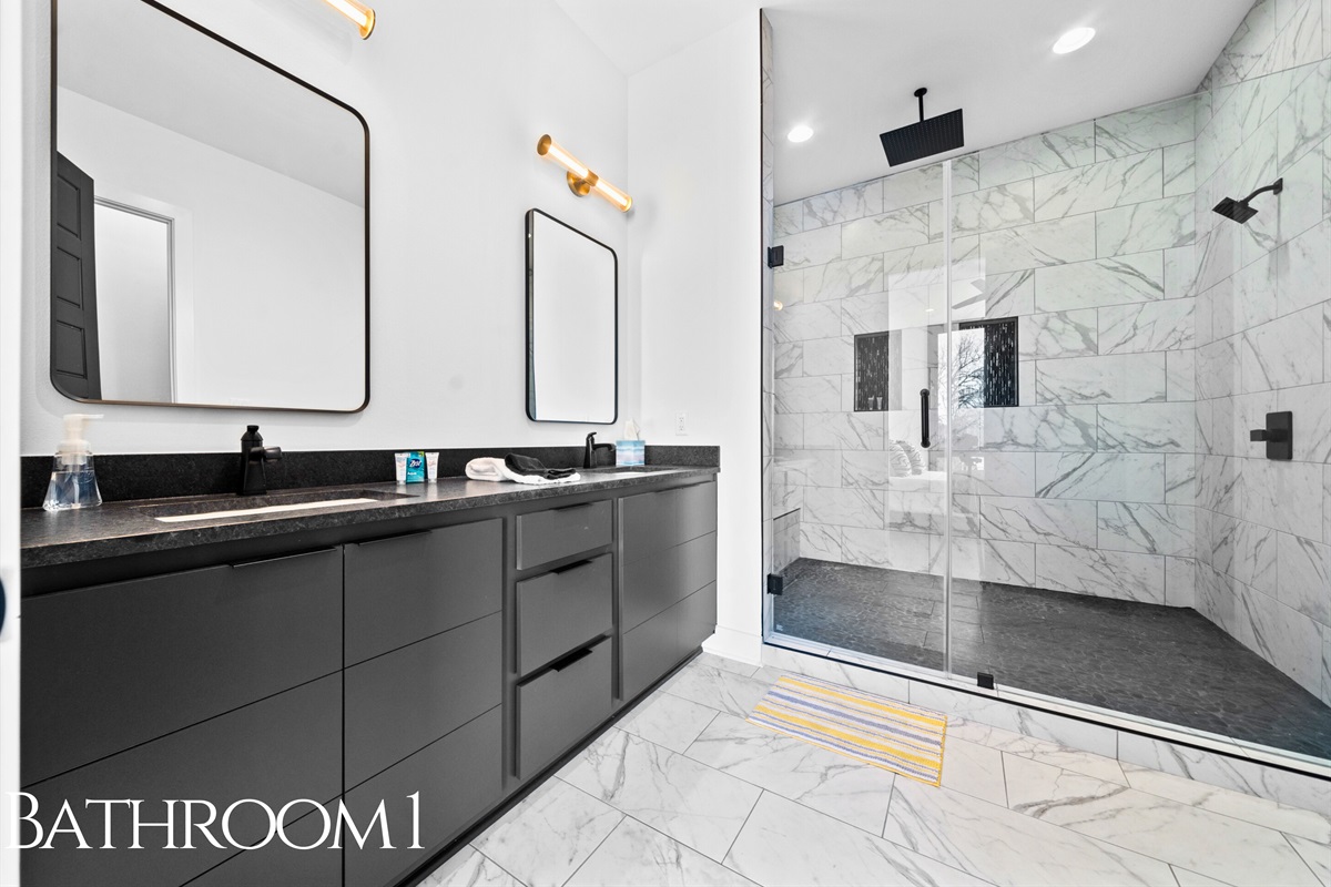 A spa-inspired bathroom featuring a sleek double vanity, clean finishes, and bright lighting that creates a calming, luxurious ambiance.