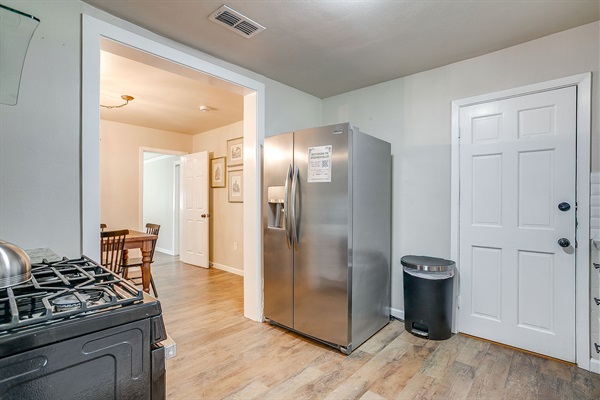 Kitchen view with stainless appliances, and storage