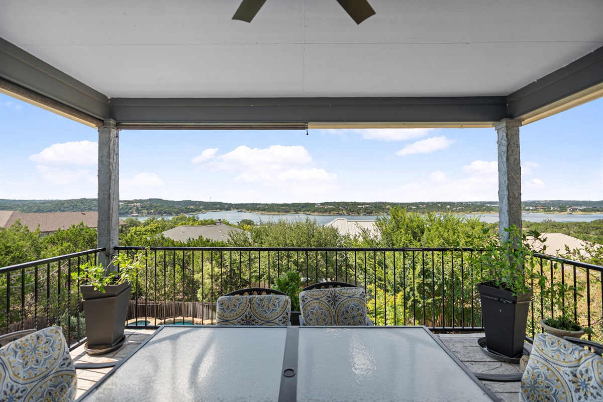 Overlooks the pool with a dining table and plenty of space to lounge and relax.