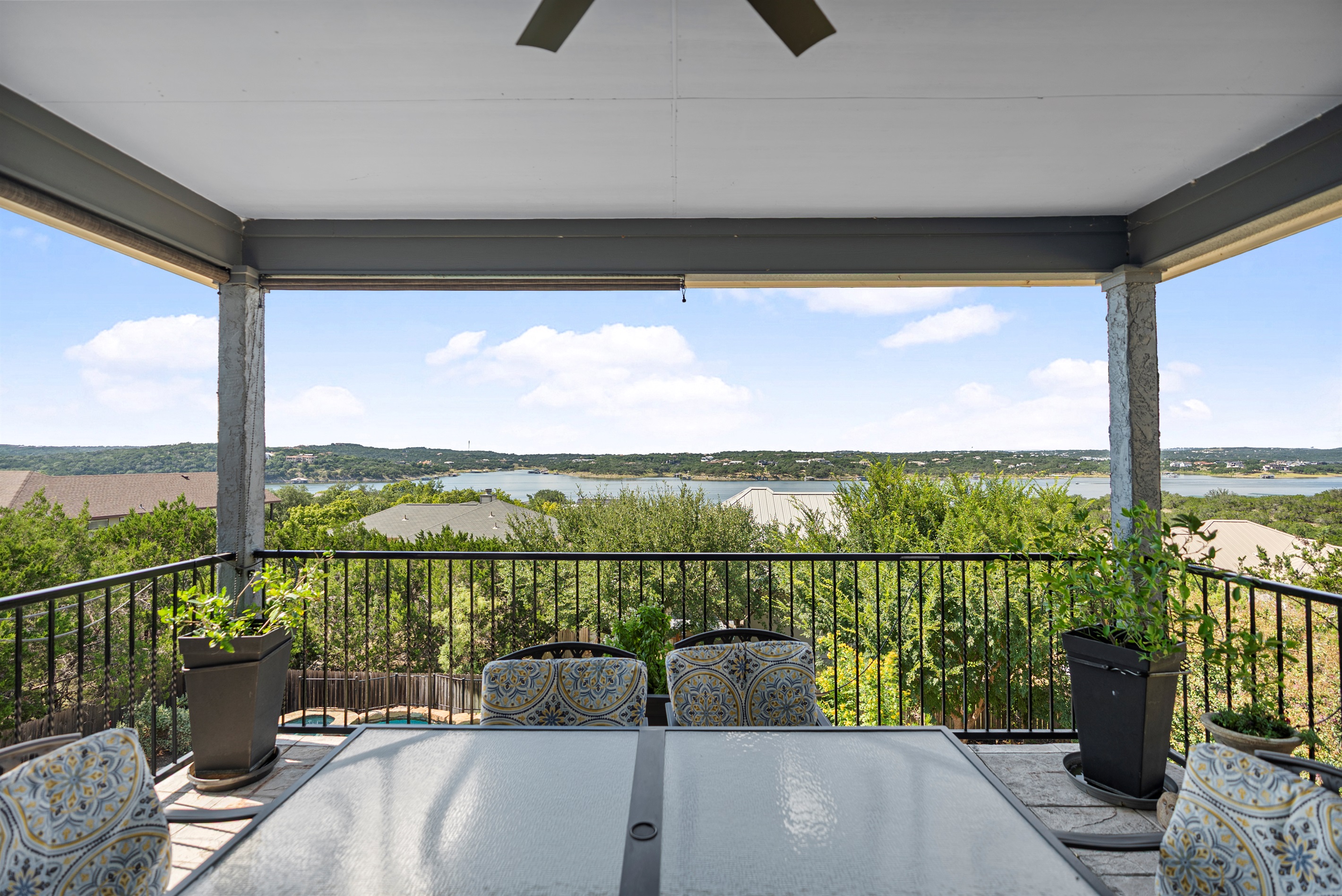 Overlooks the pool with a dining table and plenty of space to lounge and relax.