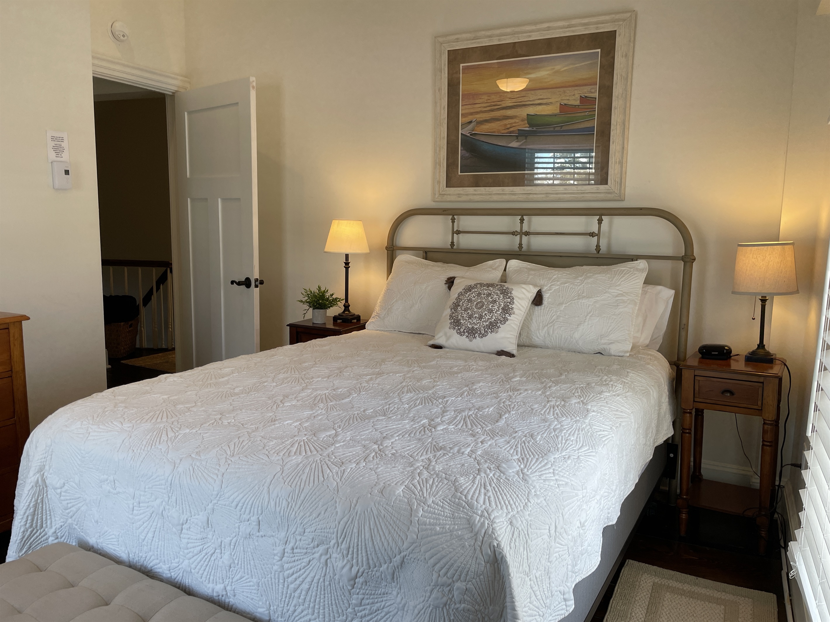 2nd floor queen bedroom showing door to hallway
