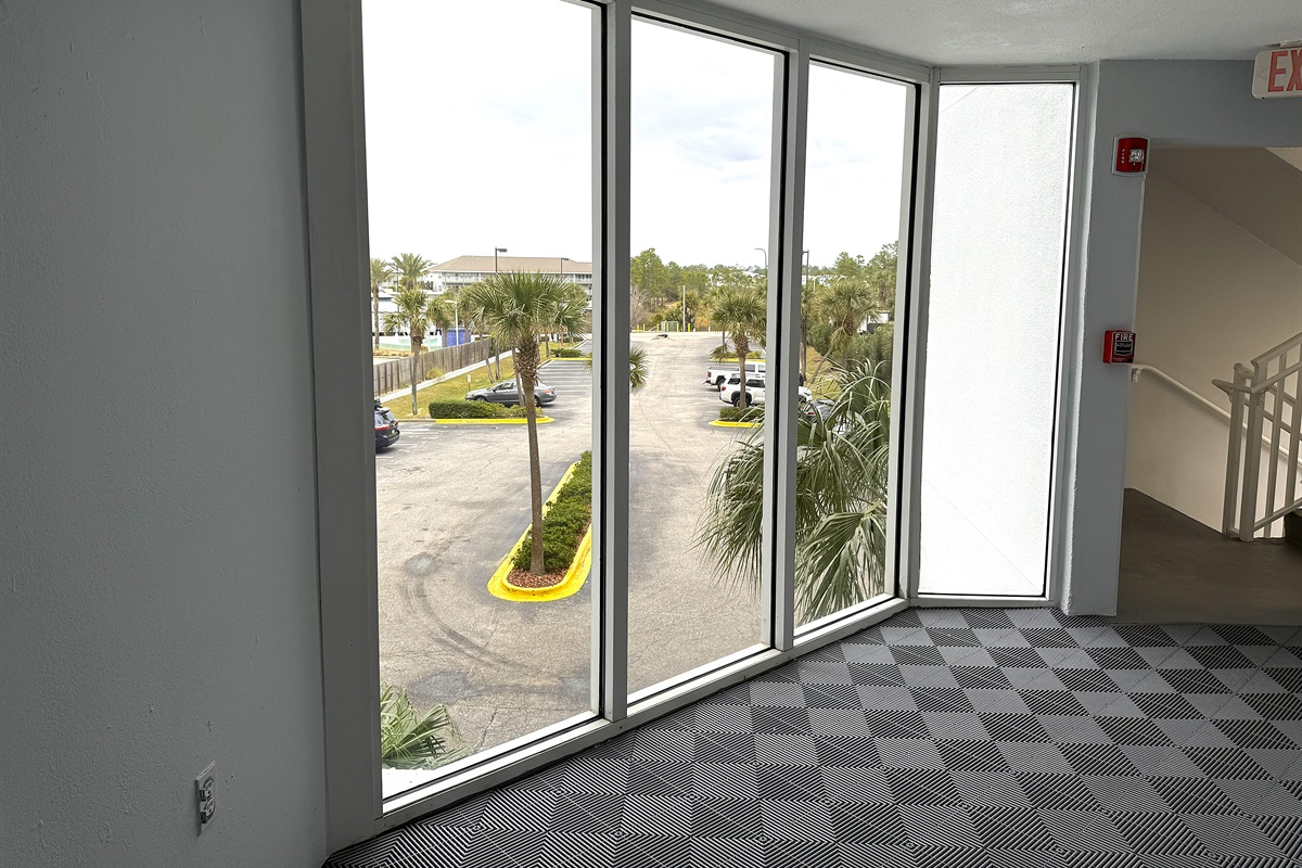 view of the parking lot from the hallway