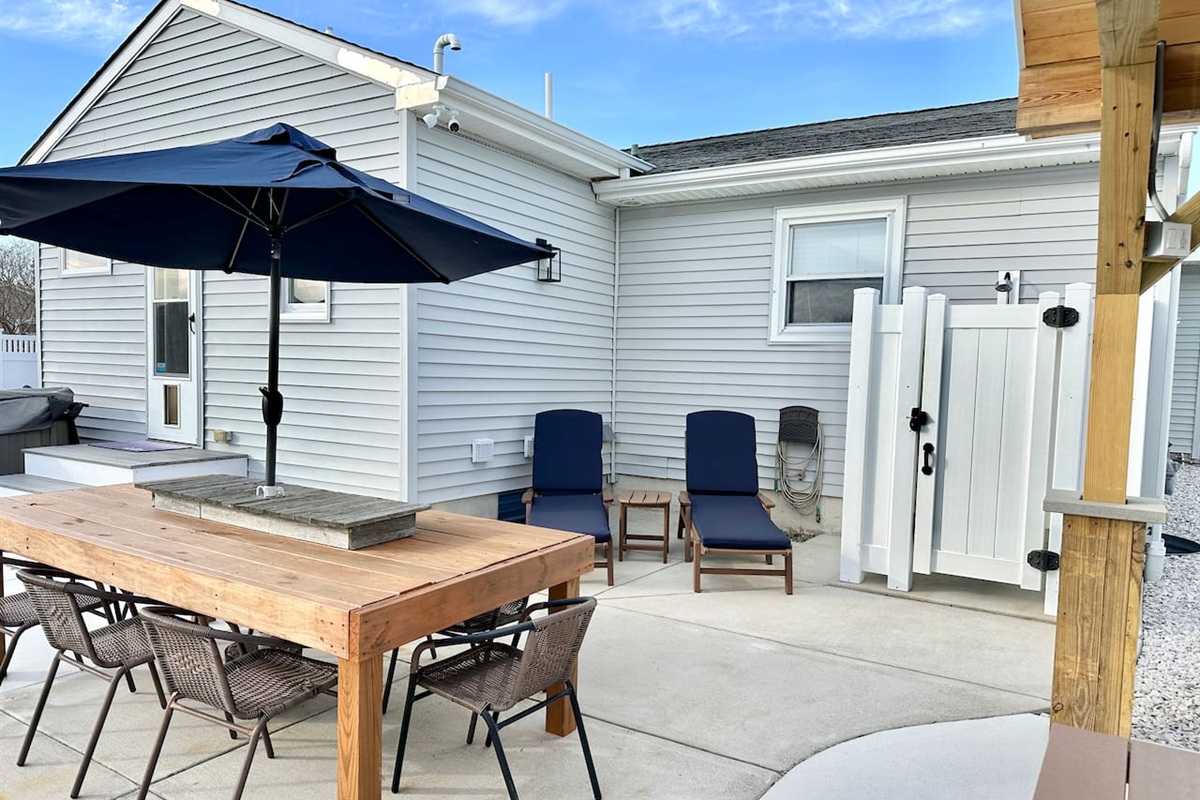 Rinse off the salt and sand in our convenient outdoor shower after a day at the beach. This private patio also features comfy loungers and a large dining table for the ultimate vacation relaxation.