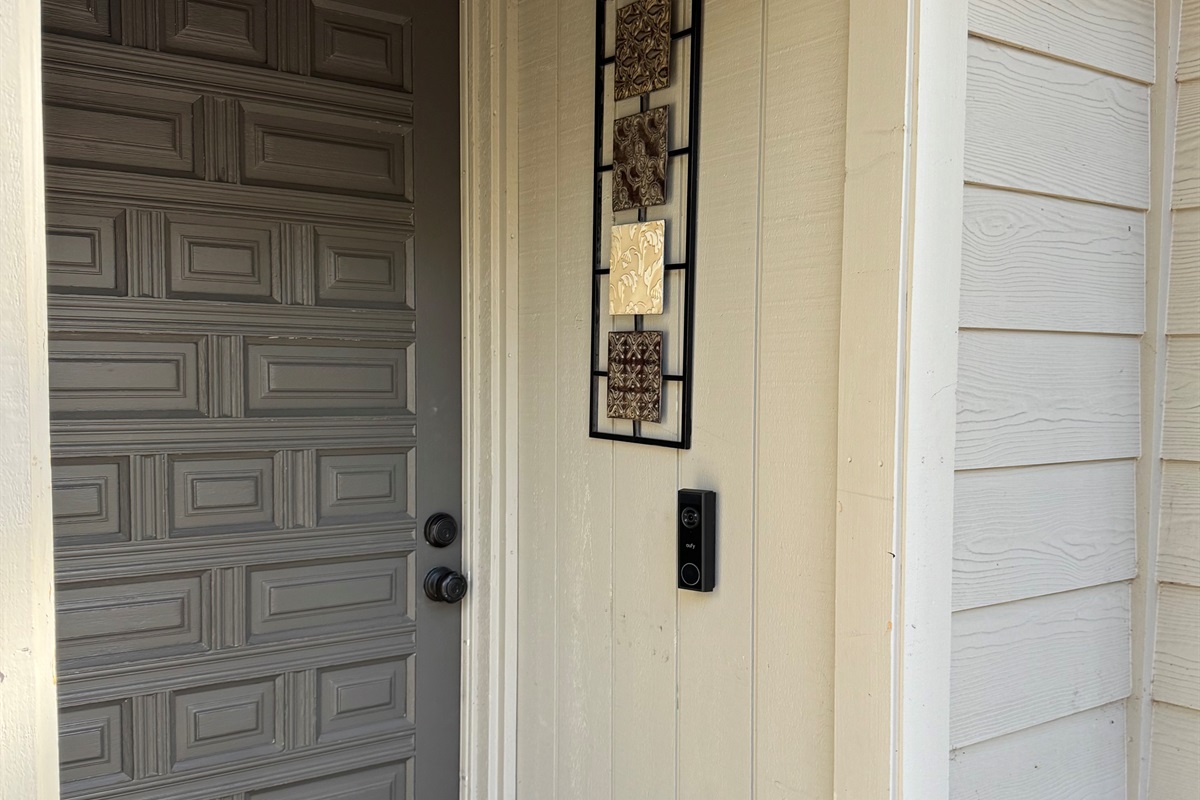 Smart camera doorbell on front door