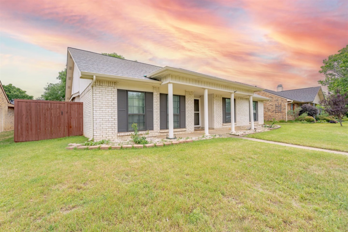 Charming brick exterior with inviting front porch.