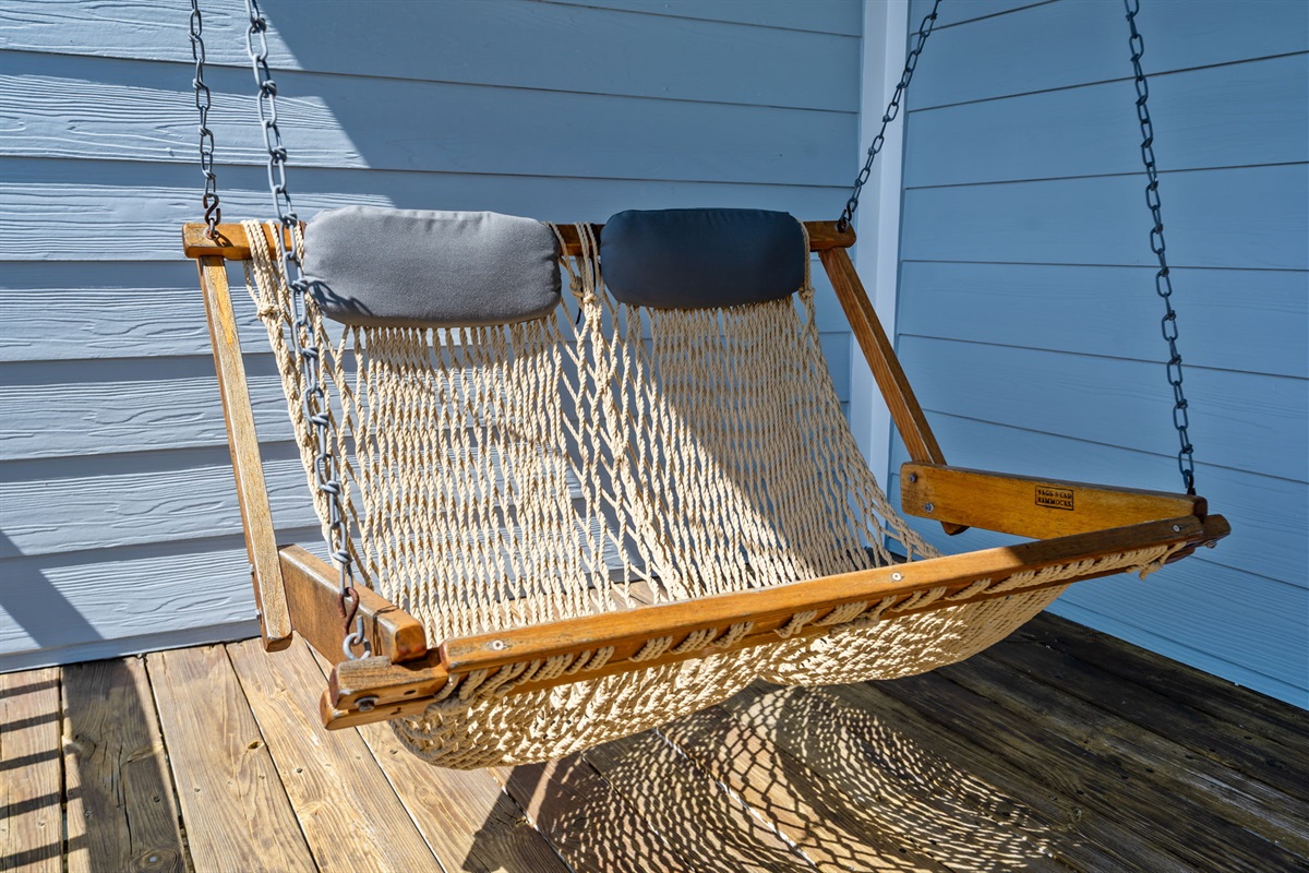 Hanging hammock chair on covered deck