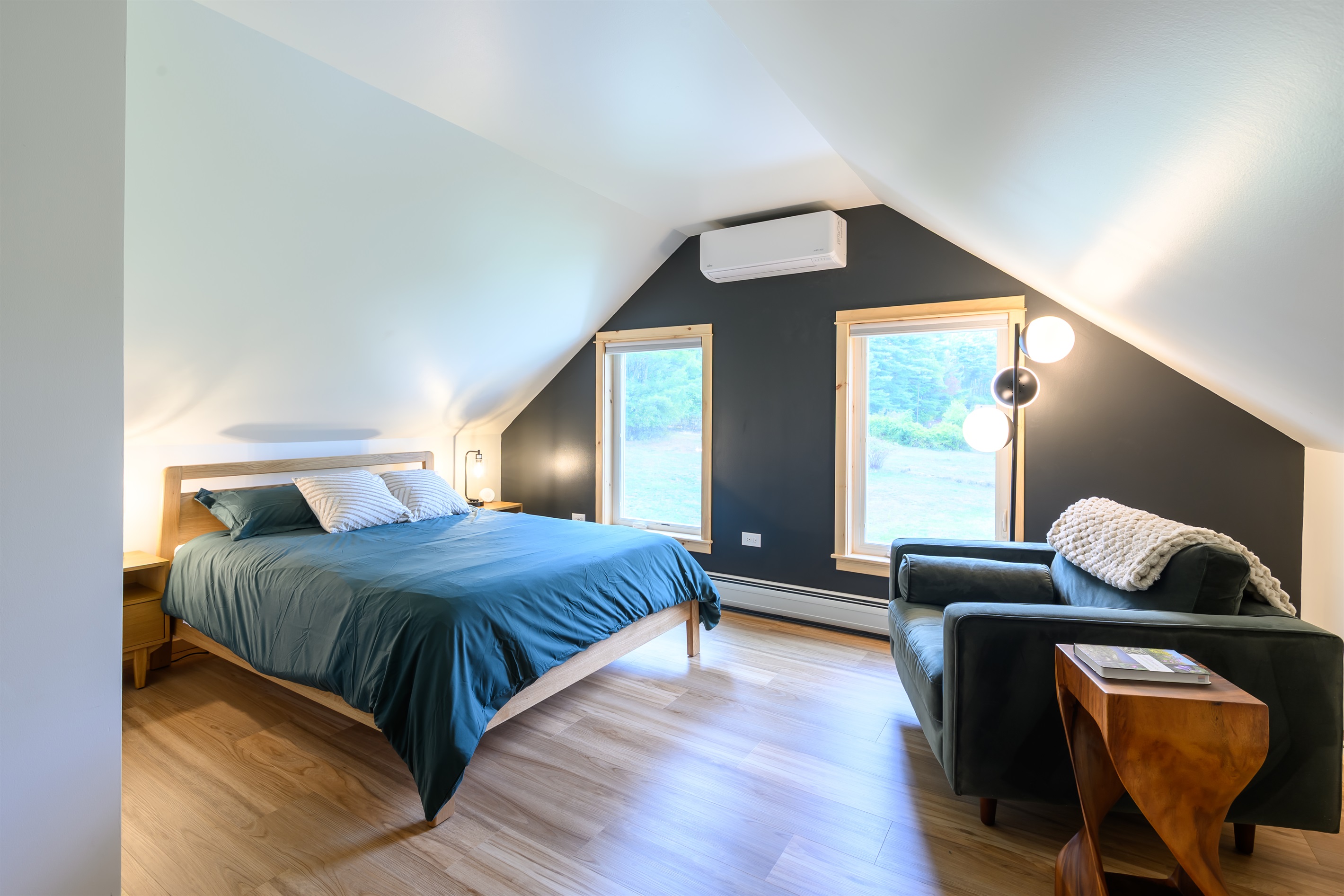 Upstairs, the oversized queen bedroom has a cozy reading nook