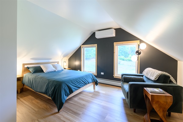 Upstairs, the oversized queen bedroom has a cozy reading nook