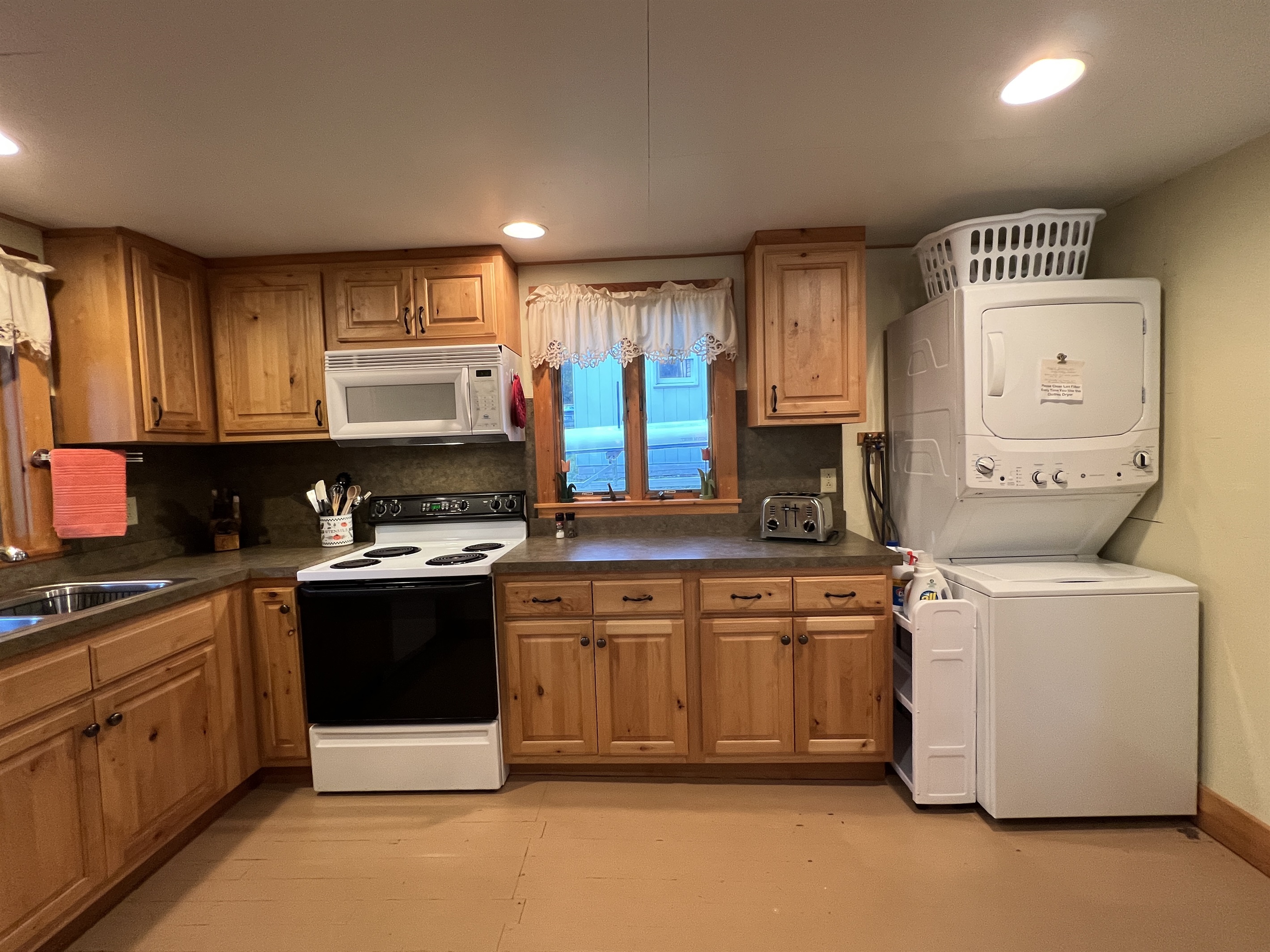 Kitchen with washer/dryer.