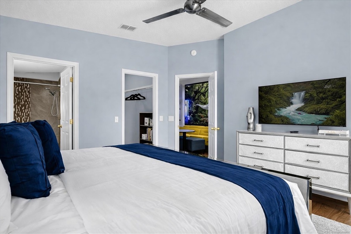 Modern KING bedroom with a large bed and 50" Roku television 50" Roku TV for streaming all your favorite shows.