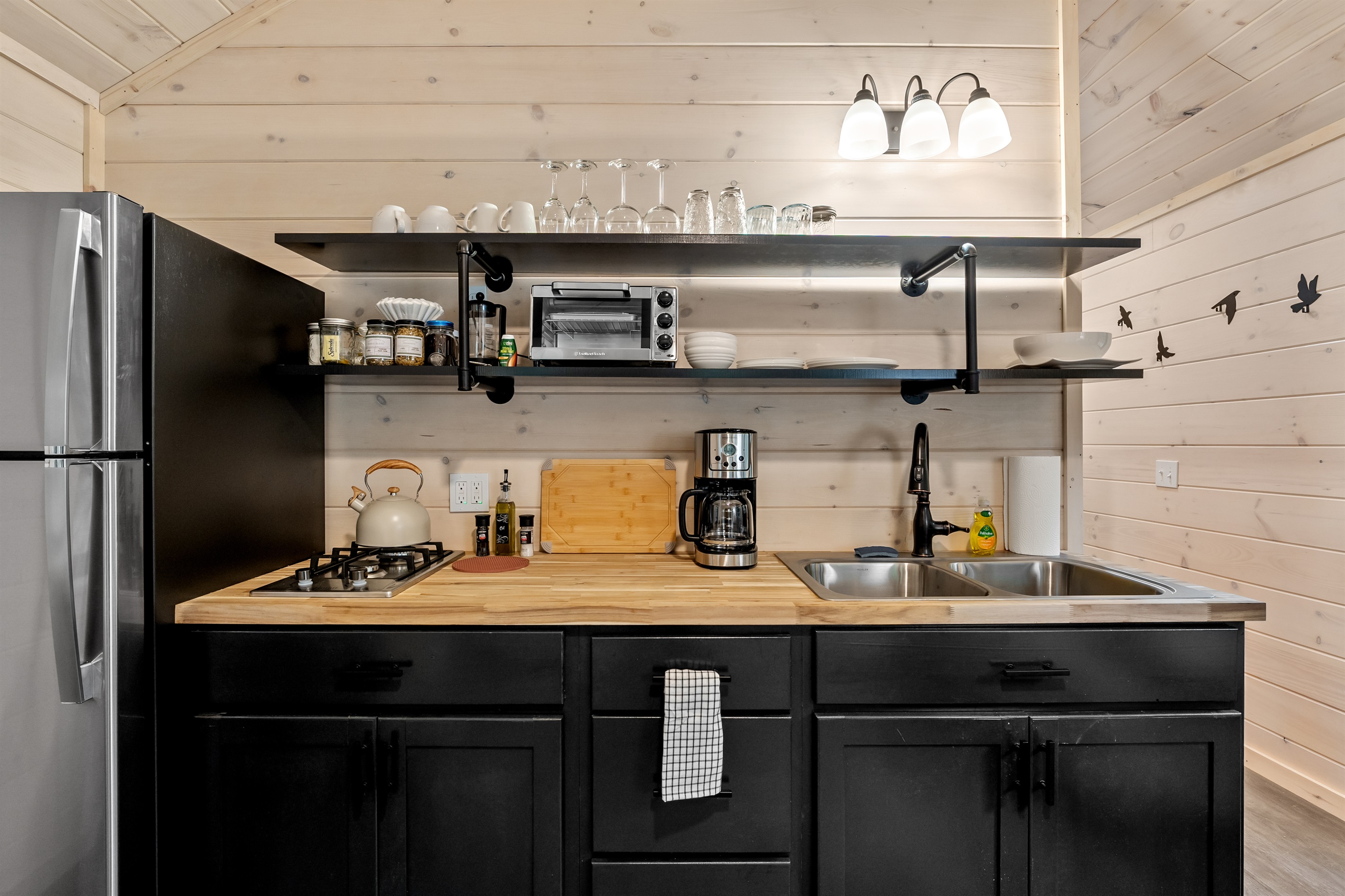 Stocked Kitchen, propane stove, air fryer, toaster, coffee and tea station, full size fridge