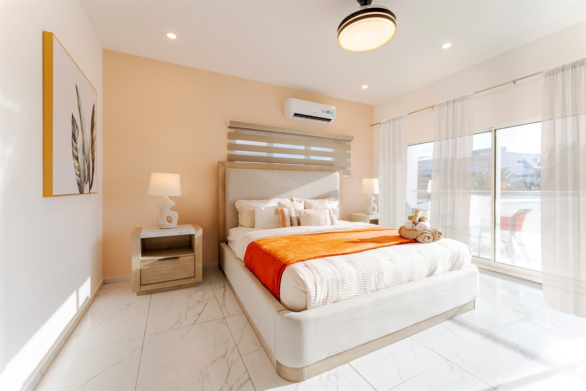 Drift off in the plush King-sized bed featuring an oversized Ac unit for climate control