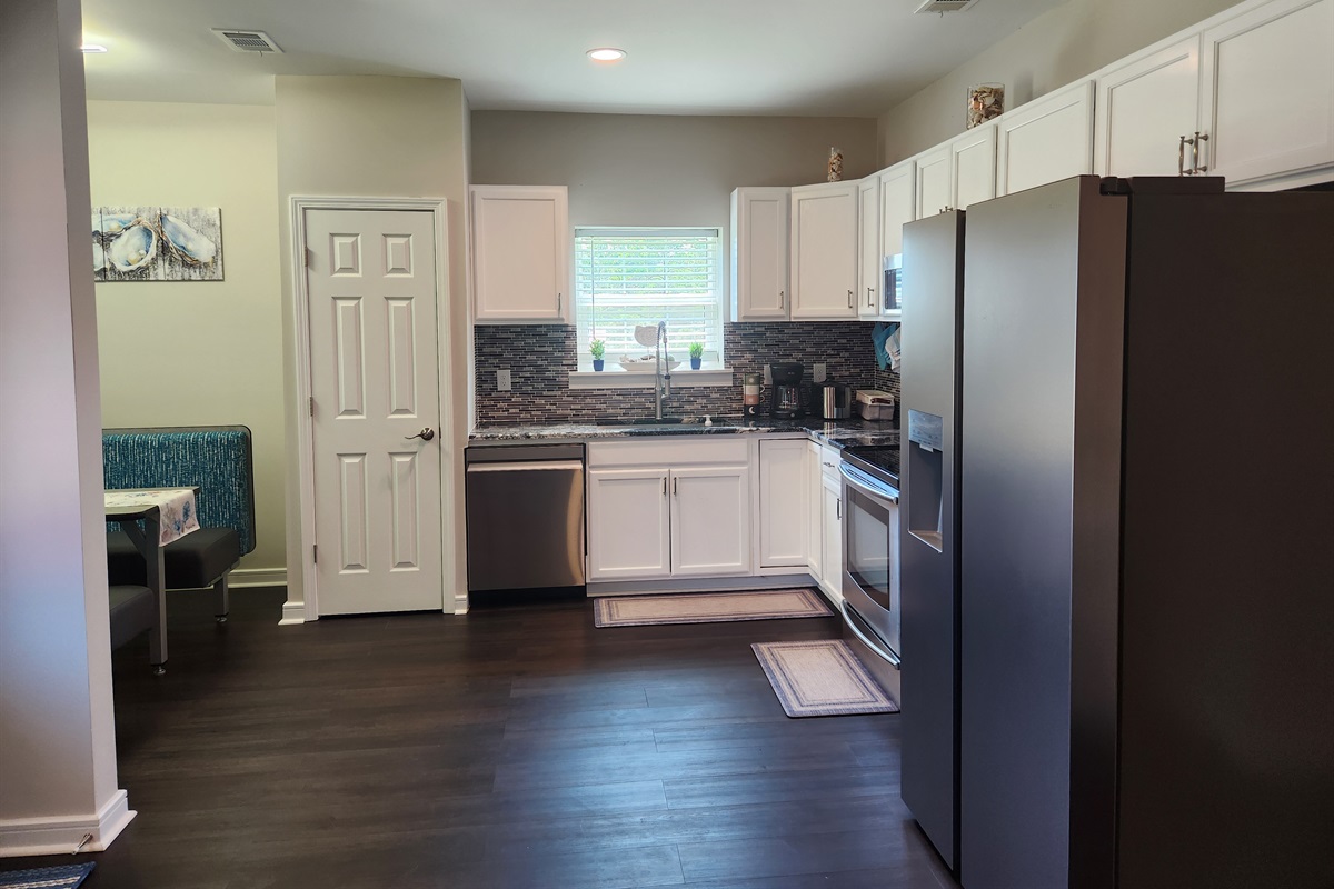 Whether you're cooking a quick breakfast or hosting a laid-back dinner, this open-concept kitchen has all you need.