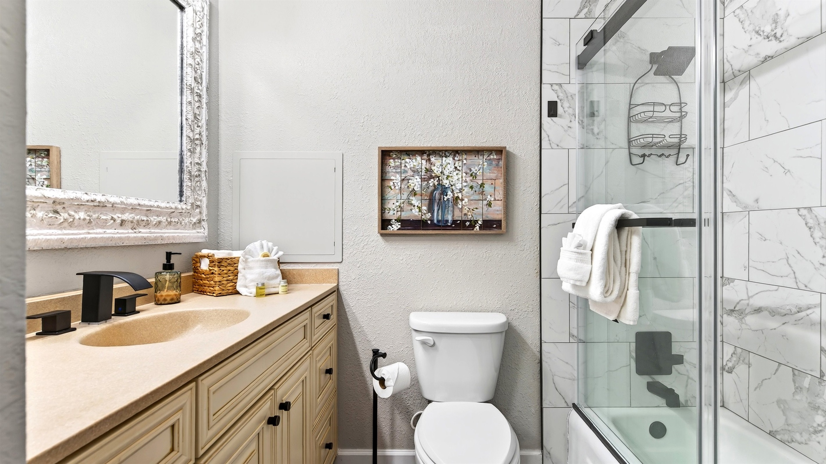 Main level 2nd bathroom with shower/tub combo.