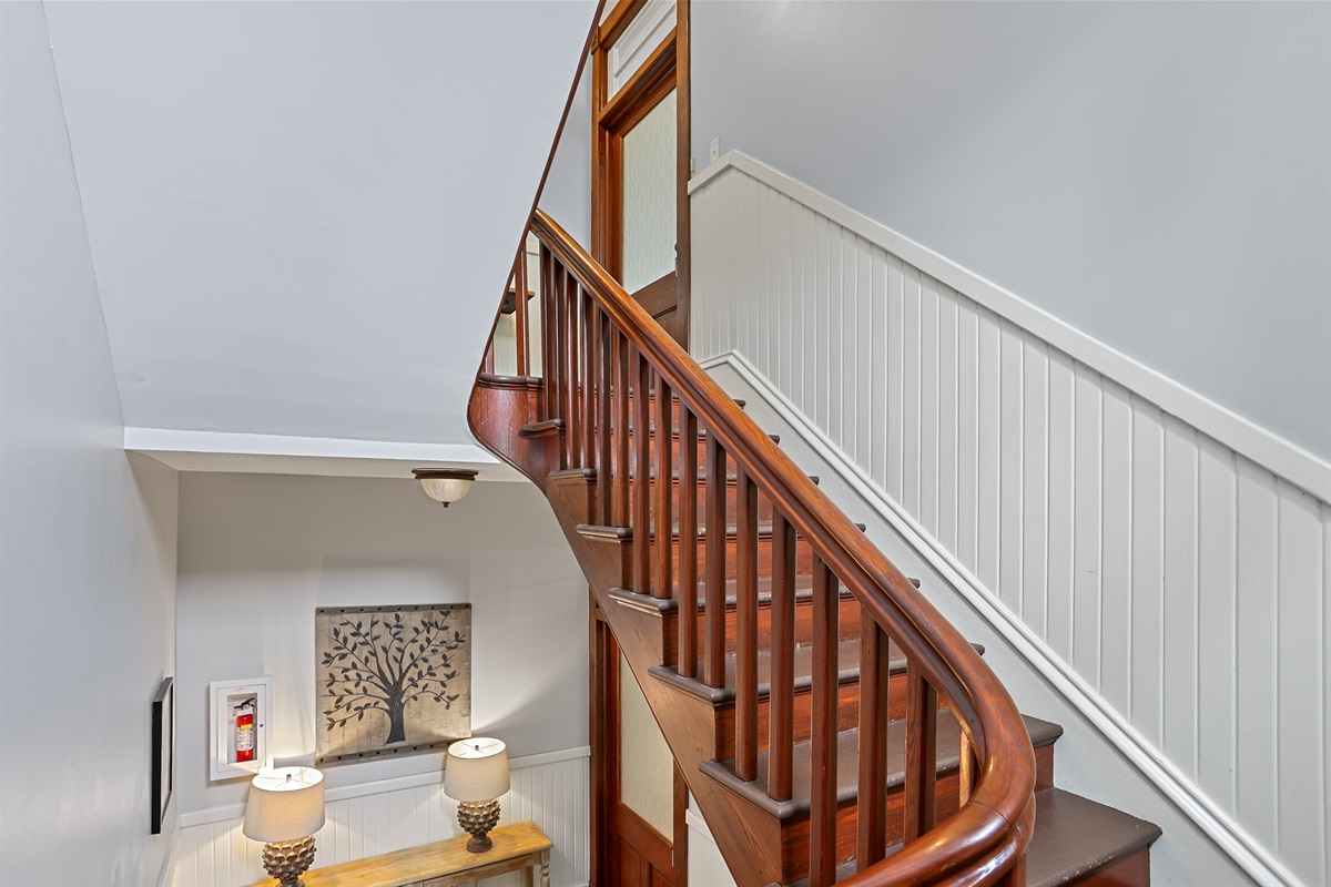 Make your way up this charming staircase to your private second-floor retreat.
