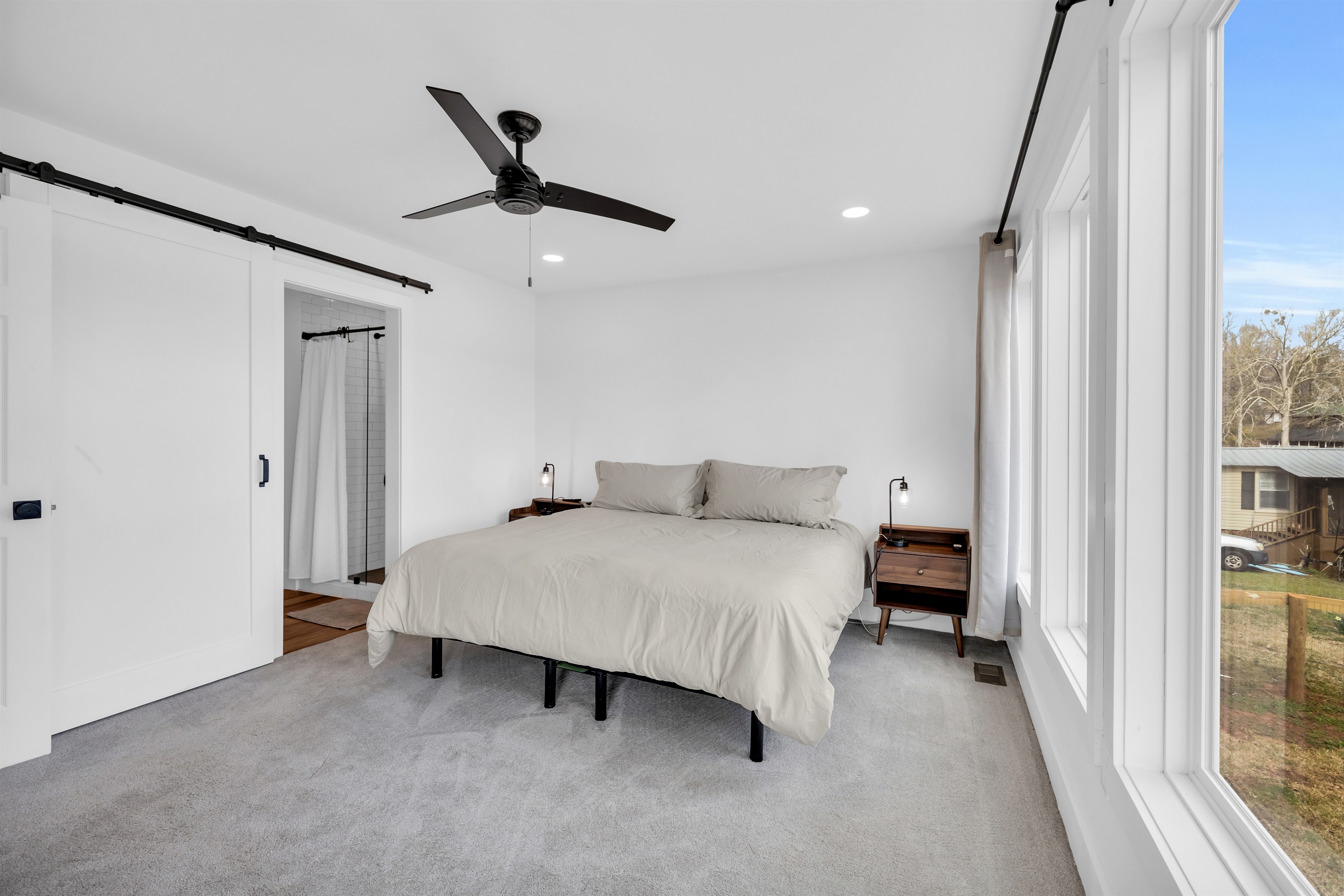 Master bedroom with king bed and a view of the lake 