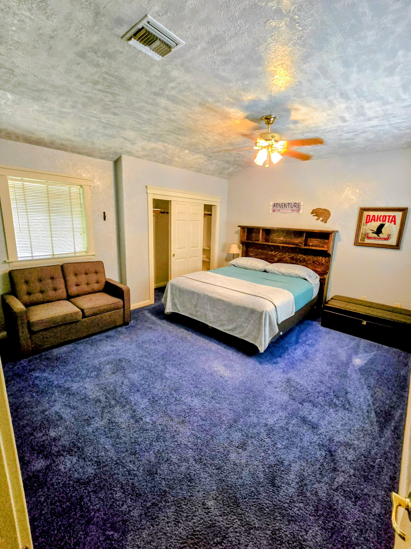 Bedroom 1 with CalKing, above garage