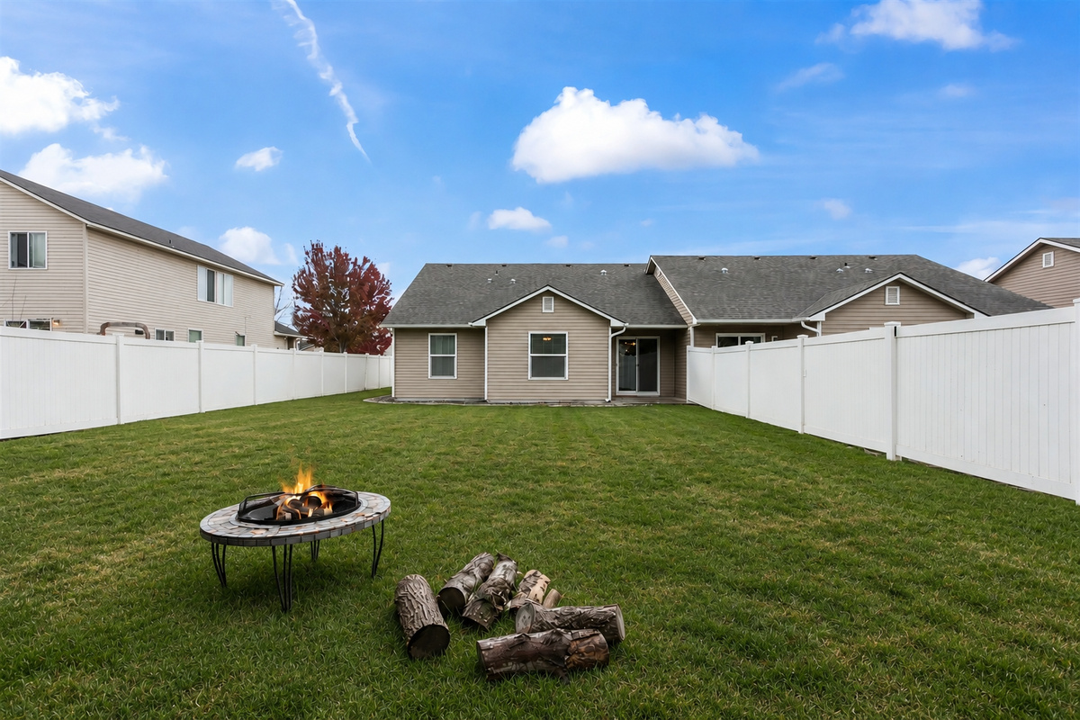 Each townhome has a large fenced back yard with a gate between the yards.  This is a photo of the yard in home #1.
