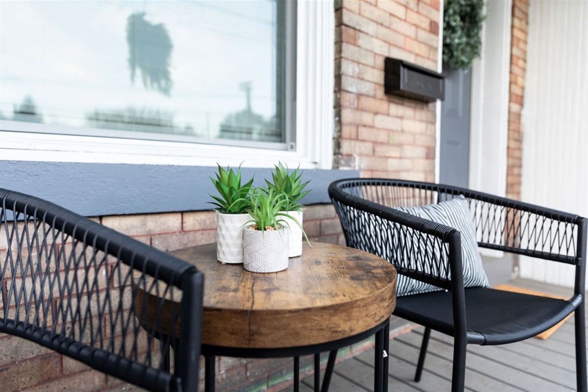 Relax and unwind on the comfortable patio seating, perfect for enjoying the outdoors.