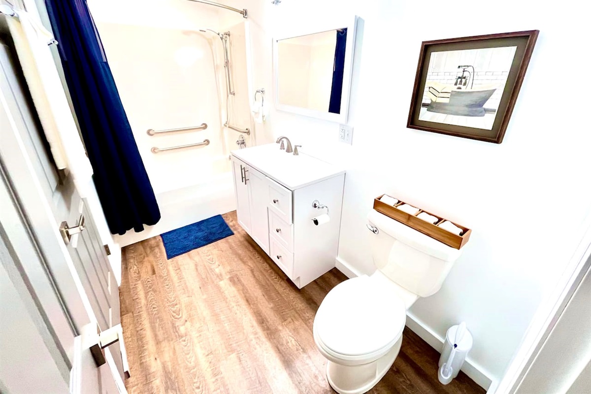 Newly renovated bathroom with shower/tub combo.