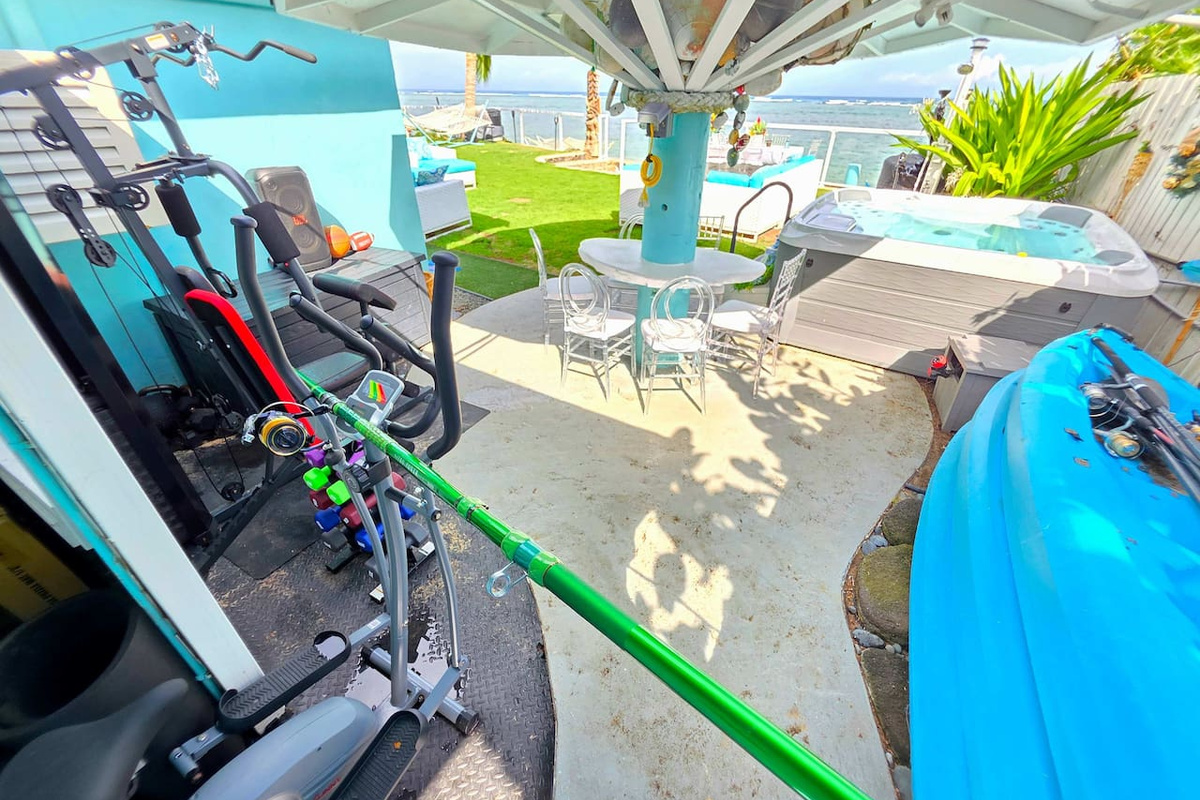 Beachfront gym of dreams in a beachfront gazebo with electrical outlets for laptops & phone charging, sauna, 7-person jacuzzi, kayaks, fishing poles, and chest with tons of snorkeling gear, watersports and sporting gear.