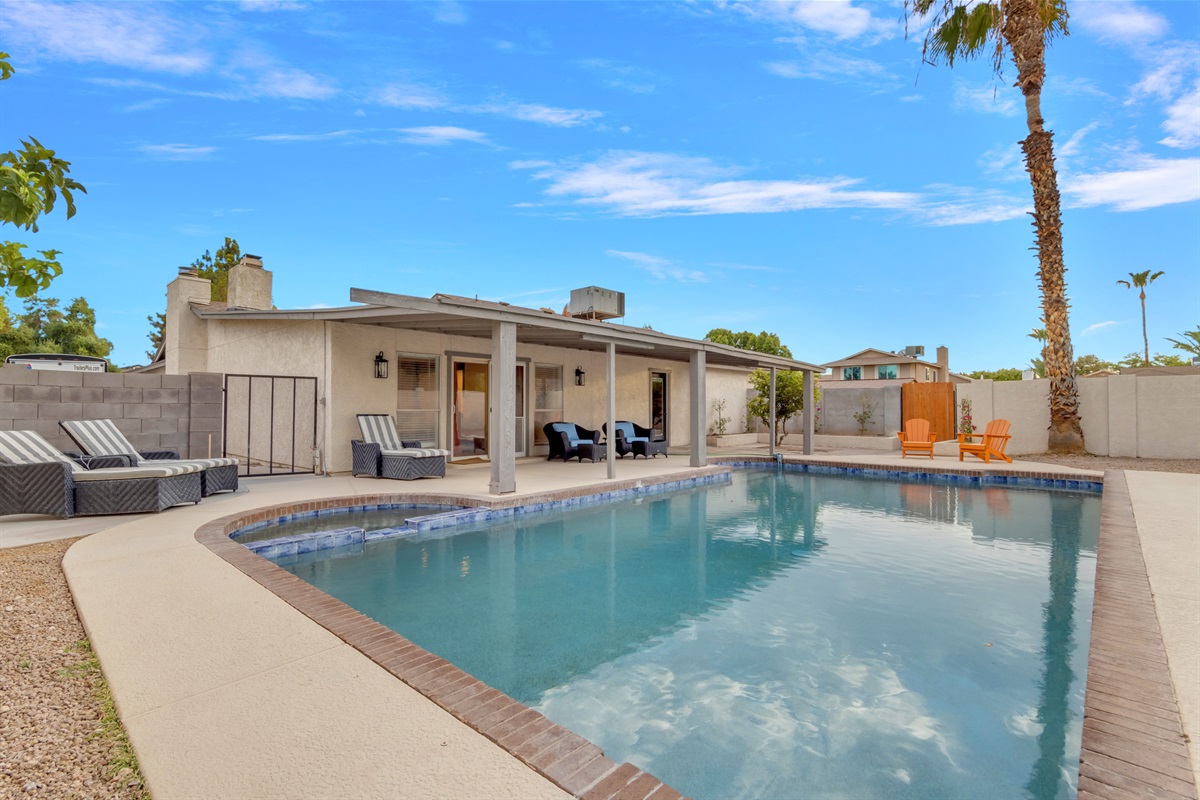 Enjoy sunny days poolside with lounge chairs and shaded seating