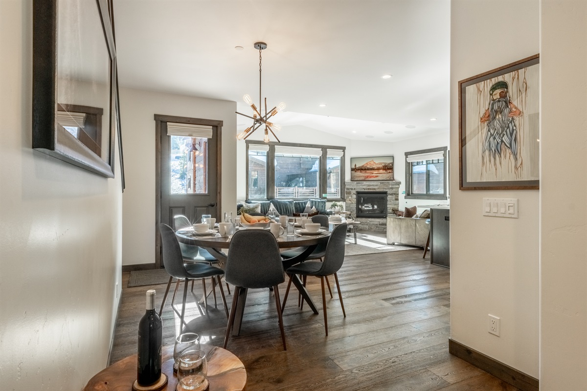Part of the home’s fully open main living level, the dining space sits alongside the fireplace and benefits from warm south-facing light—creating an easy, welcoming place for groups to gather throughout the day.