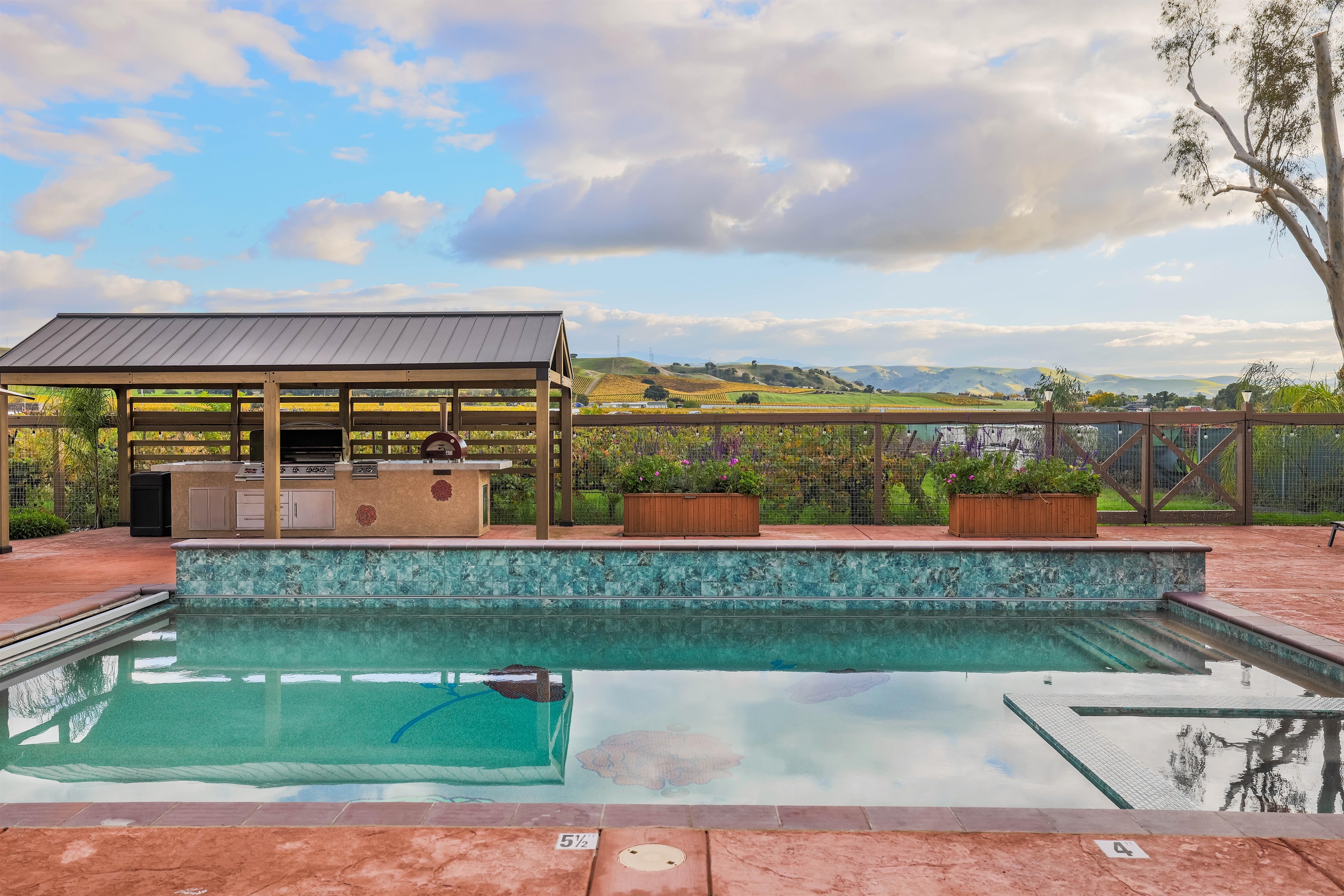 Our new pool, hot tub, BBQ, fire table, and gazebo.