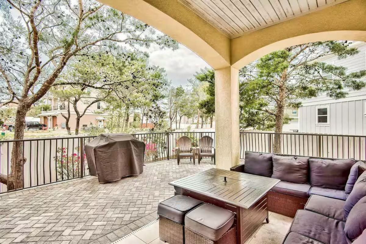 Door from dining room opens into patio with BBQ area
