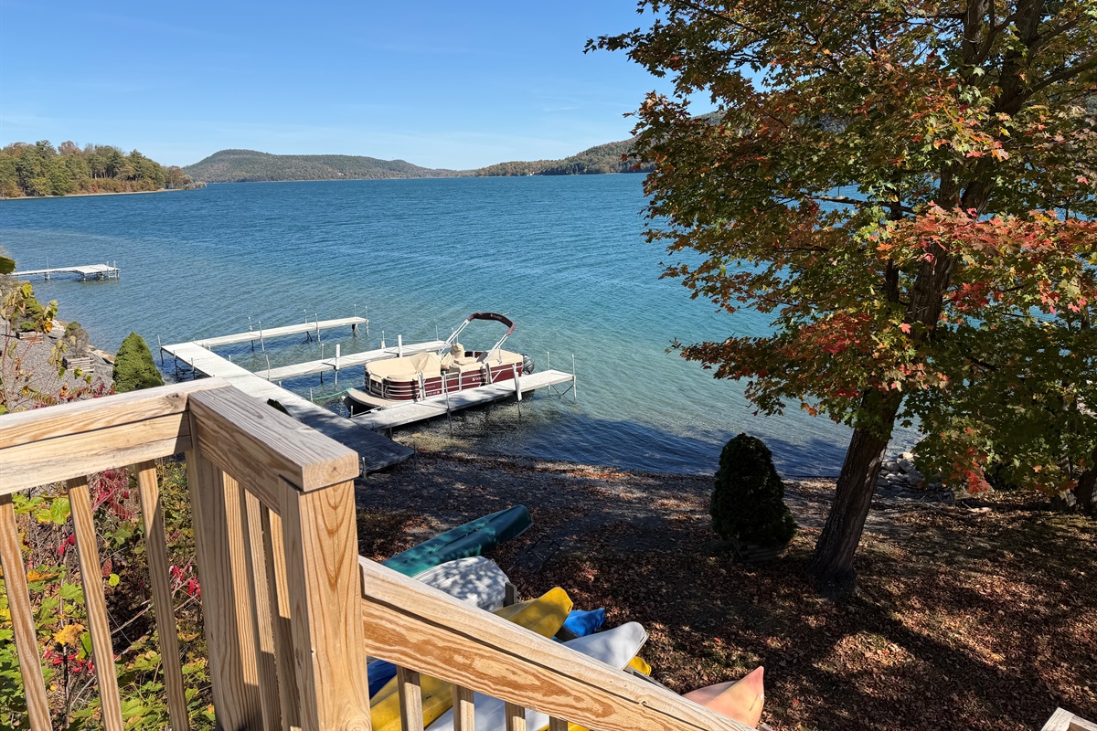 Shared waterfront with dock slips and kayaks