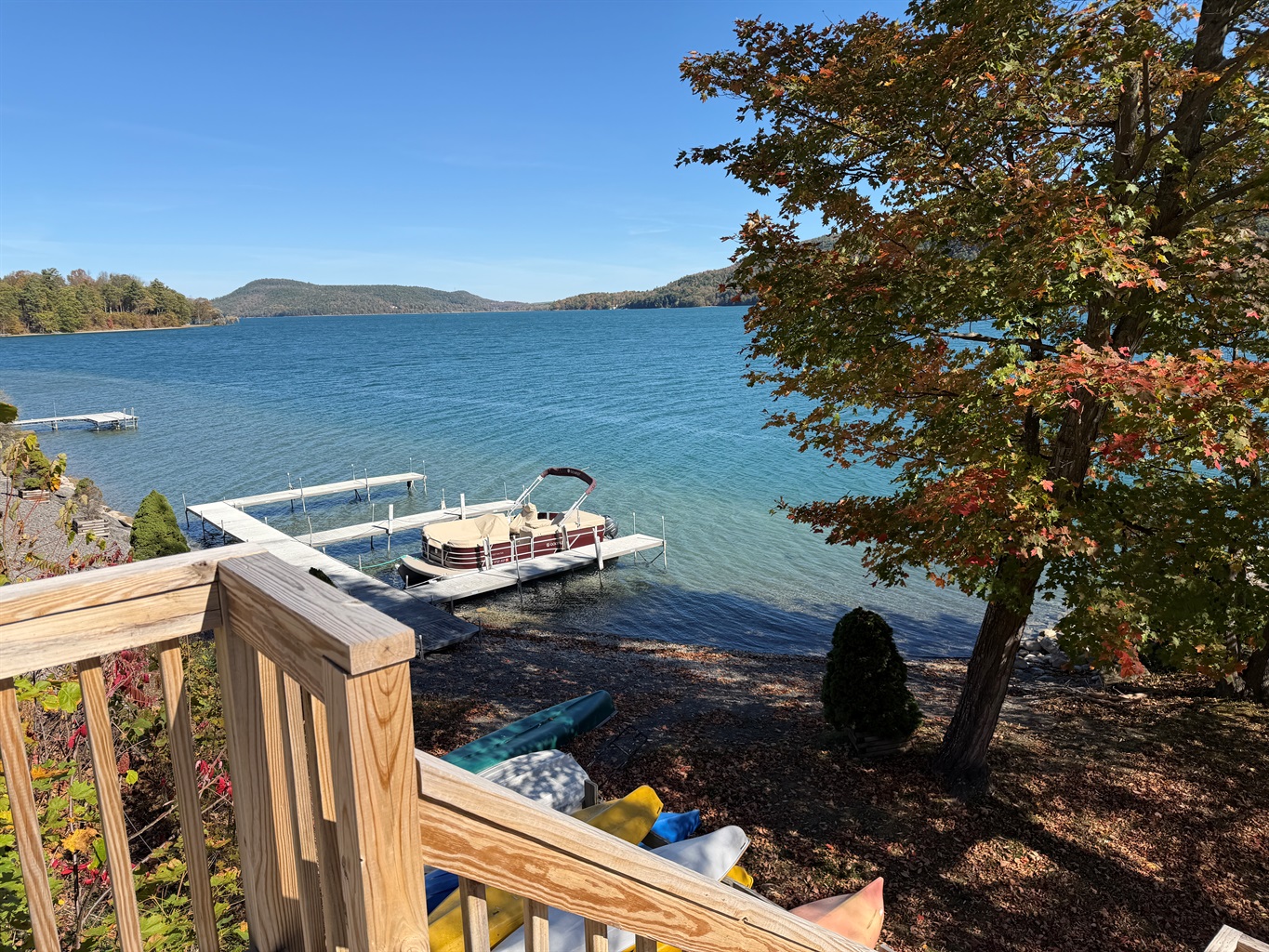 Shared waterfront with dock slips and kayaks