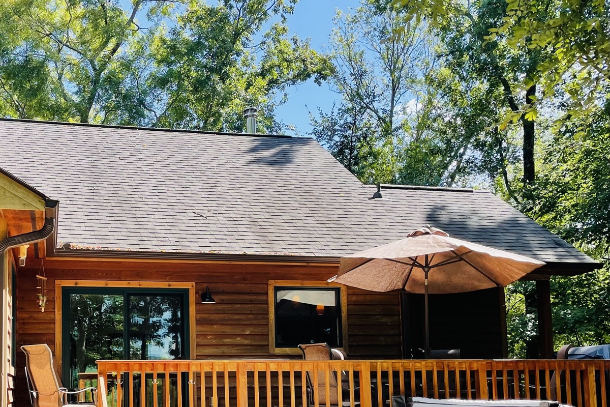 Back deck oasis, with hot tub, grill and dining table