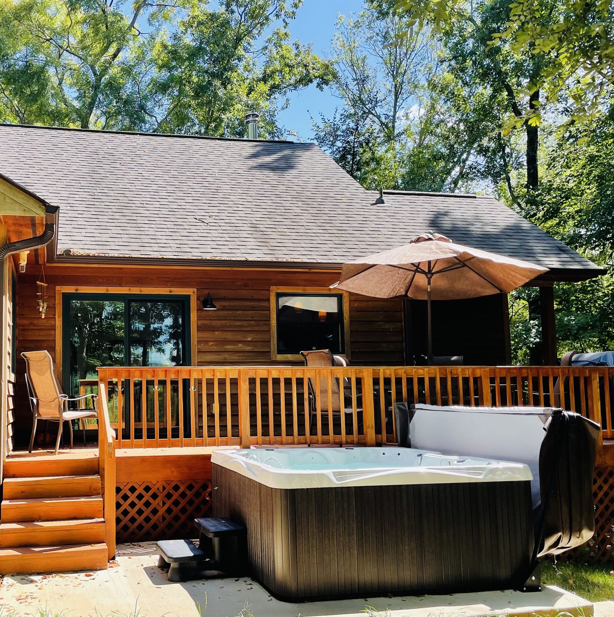 Back deck oasis, with hot tub, grill and dining table