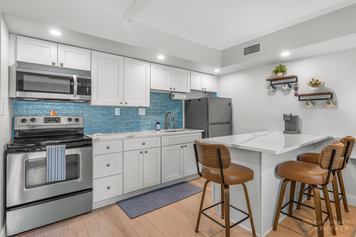 Updated Stainless Steel Kitchen with Bar Seating