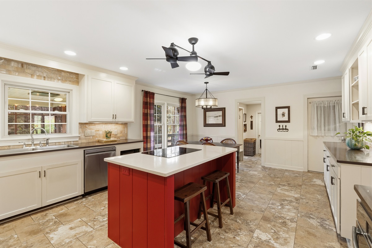Kitchen with breakfast table and bar seating