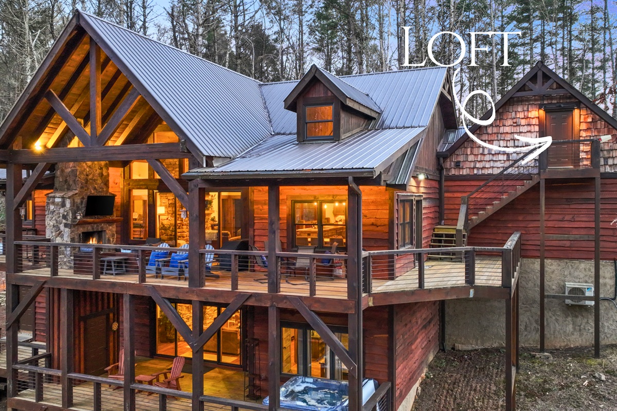 This side view highlights the home&rsquo;s expansive decks, ideal for outdoor living and entertaining.