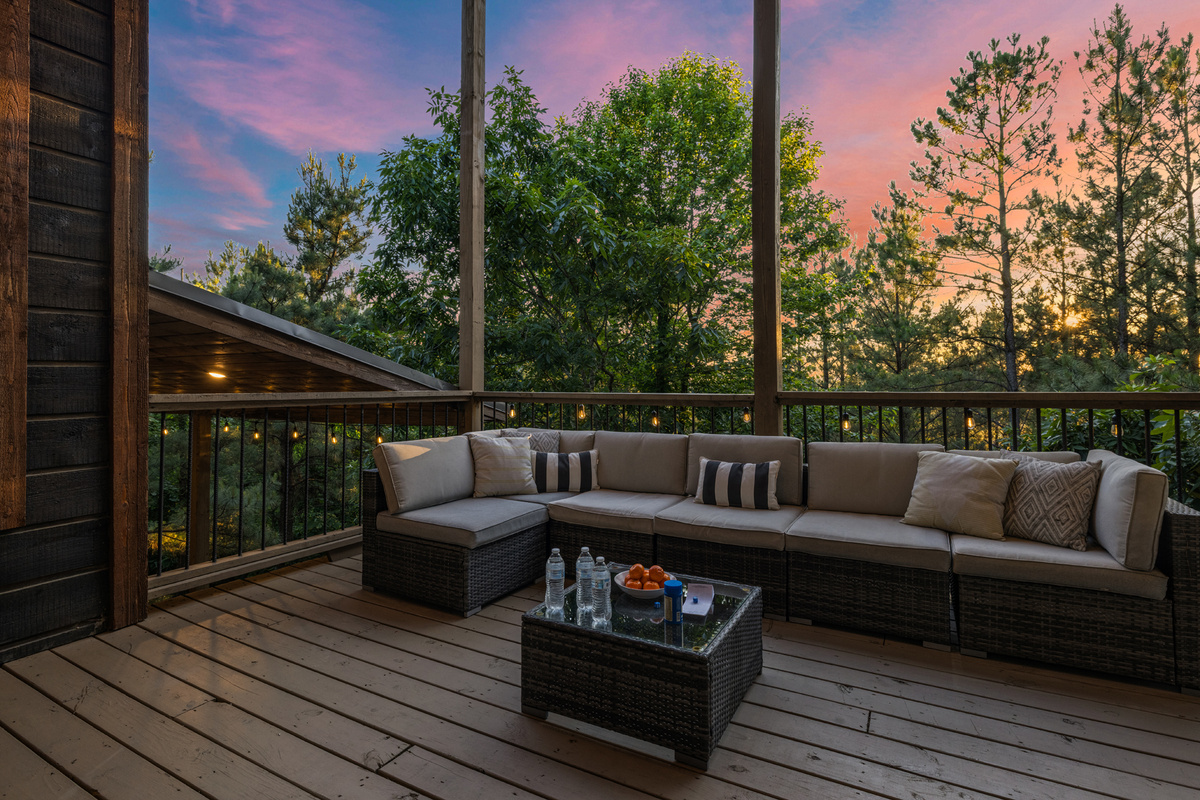 A comfortable outdoor patio with seating and a TV — perfect for relaxing, watching, and enjoying the fresh air