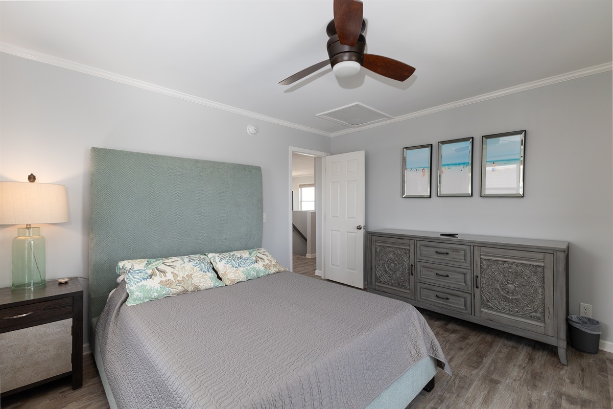 Inviting bedroom with ceiling fan and stylish furnishings