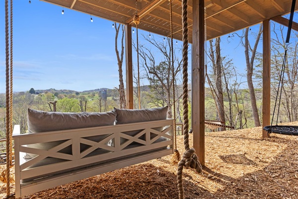 Our swing / play area has something for everyone! Relax on the oversized bed swing, hammock swing or get playful on the spider swing. If you are adventurous, see if you can touch the ceiling on the climbing rope! The views will melt away all cares!