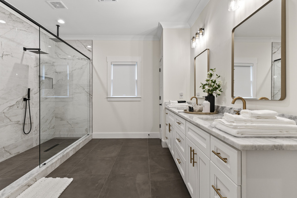 Extra large walk in shower with dual shower heads and double vanity sink, luxury soaps, lotions and a bidet in the water closet. 