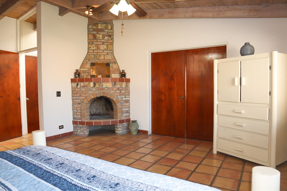 Circa Del Mar - Master Bedroom with King bed, en-suite bathroom, and fireplace.