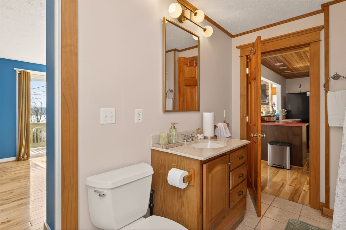 “Clean, modern bathroom with soaking tub and spa-style bath tray—perfect for relaxing and recharging.”